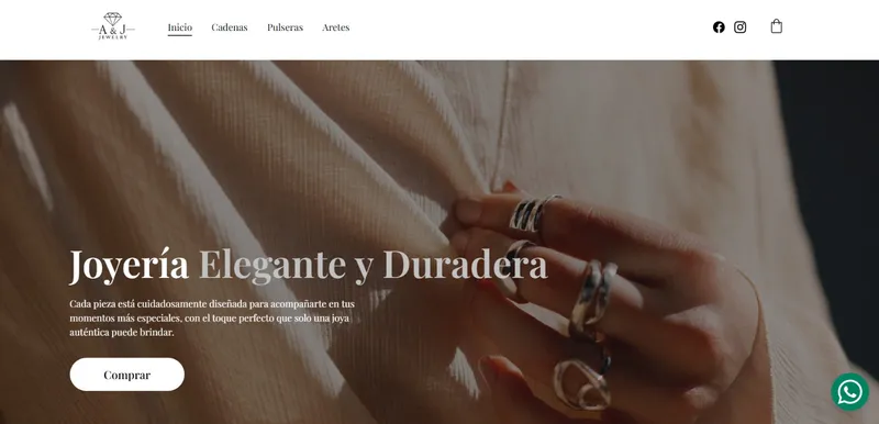 Inicio del sitio de A&J Jewelry en computadora: mano con anillos de plata y el titular Joyería elegante y duradera